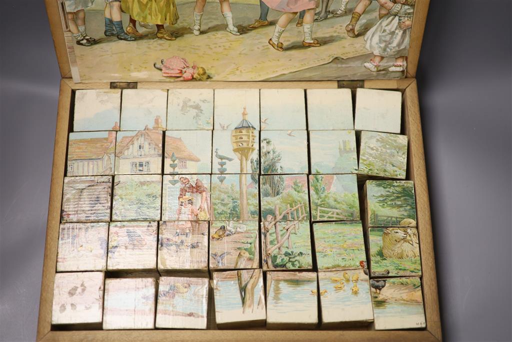 A Victorian chromo-lithographed building block set in original case.